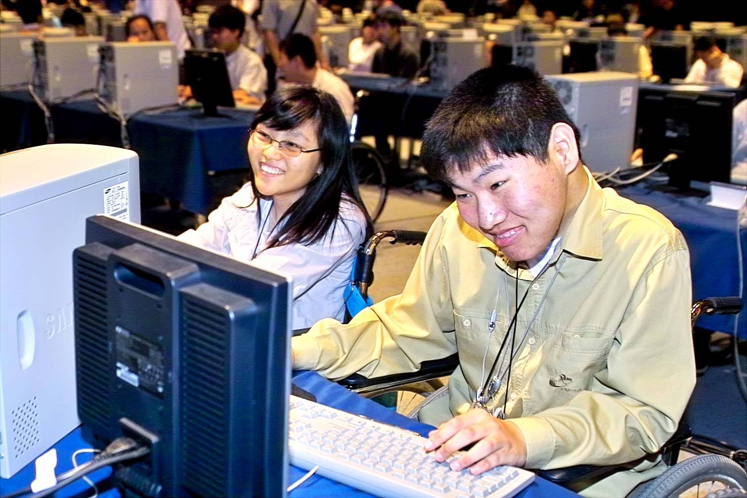 Chang Gon Kim, vice-minister of information and communication, is shown giving the opening speech for the `SK Telecom 2004 Internet Search Contest for Physically Challenged Youth`